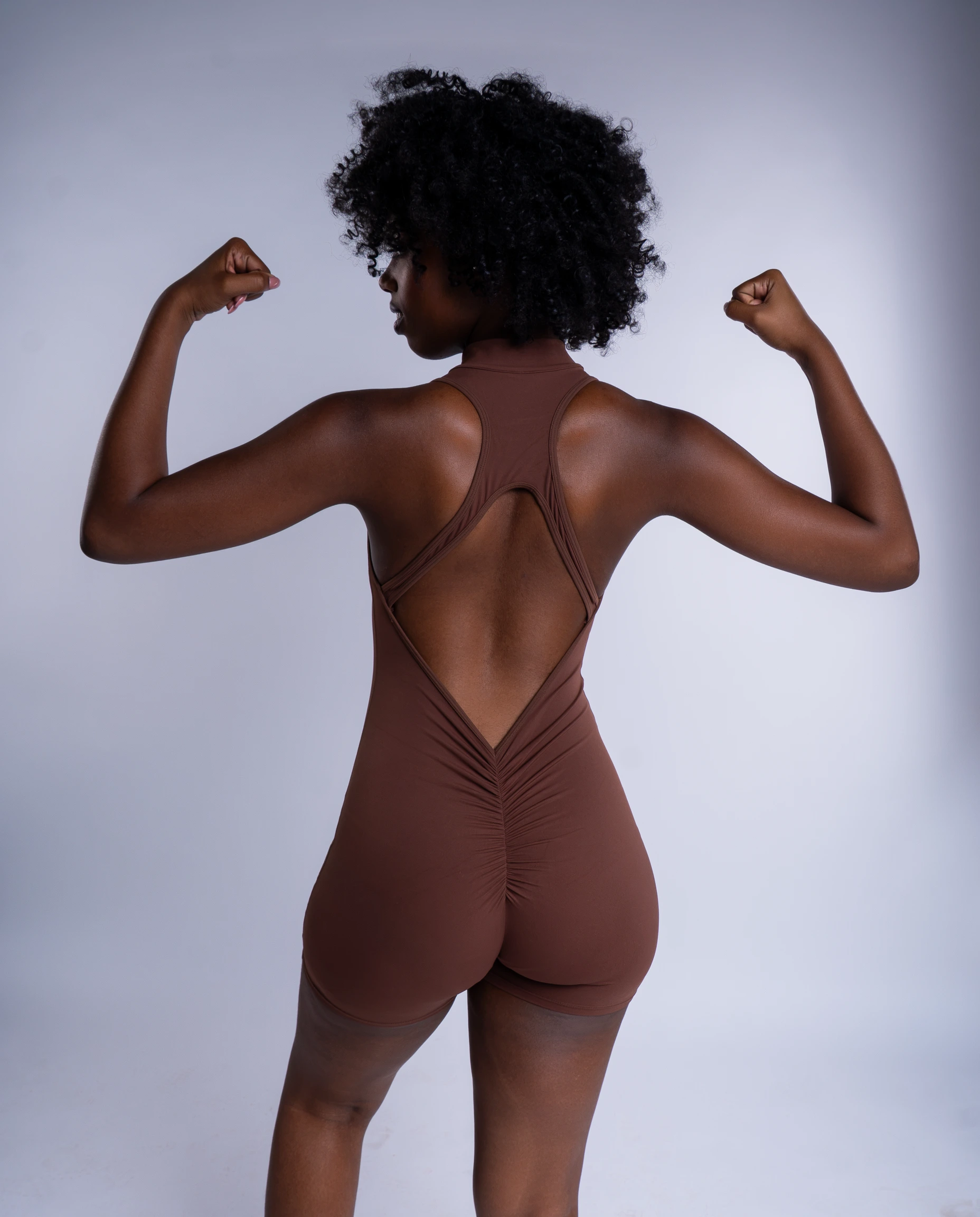 ARAIN Lumen Sleeveless Half-Zip Jumpsuit in Brown, detail